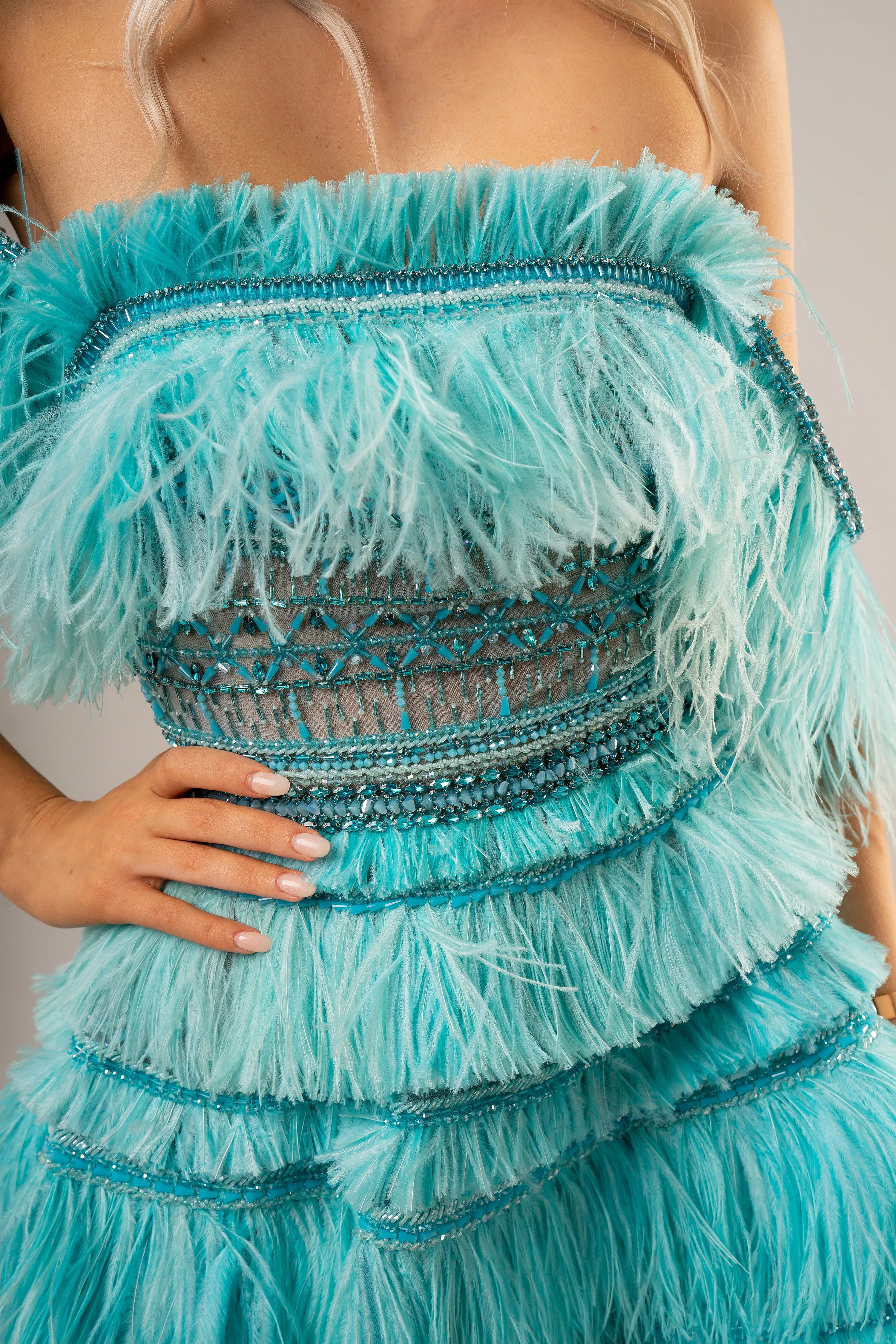 Bright blue feathering off the shoulder and short layered skirt dress